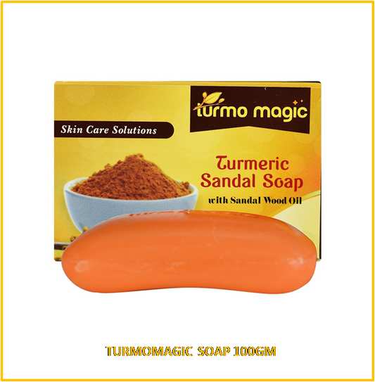Packaging of Turmomagic Soap with a picture of the bar soap and a bowl of turmeric sandalwood oil. The package has a yellow and orange color scheme with text detailing the product name and weight (100gm).